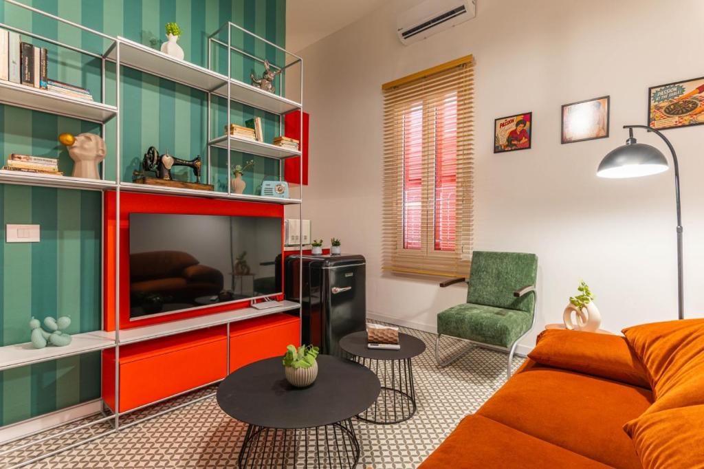 a living room with a couch and a table at DAR MEMOIR Apart Hotel in Al Mudawwar