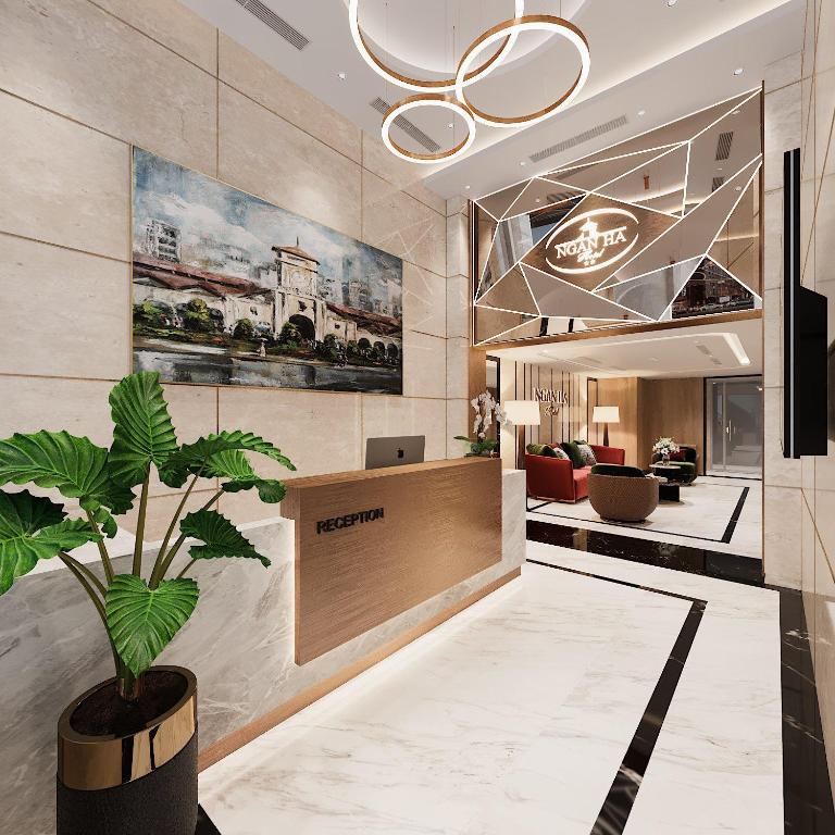 a lobby of a hotel with a potted plant at Ngan Ha Hotel - Ben Thanh Central in Ho Chi Minh City