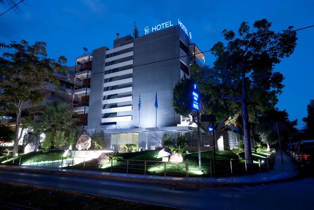 a building with a blue sign on the side of it at The Crystal Blue Hotel in Athens