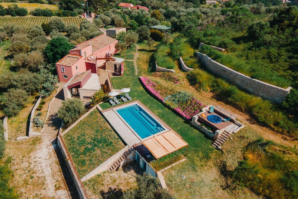 an aerial view of a house with a swimming pool at VILLA SUMAC 6, Emma Villas in Sortino