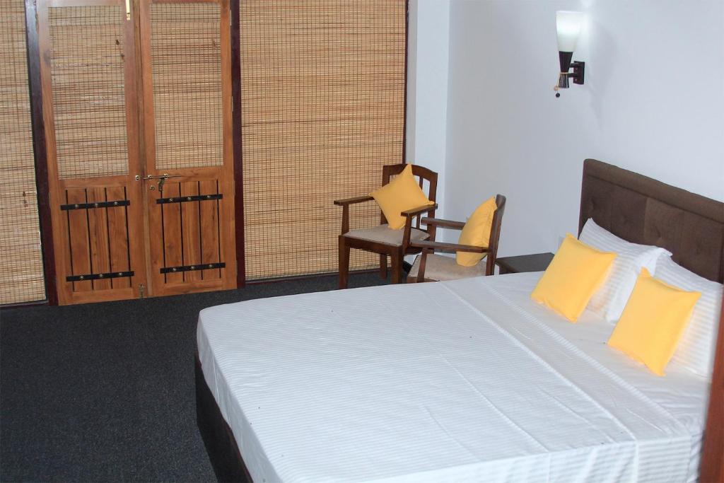 Postel nebo postele na pokoji v ubytování Elegant Hamlets Home Stay