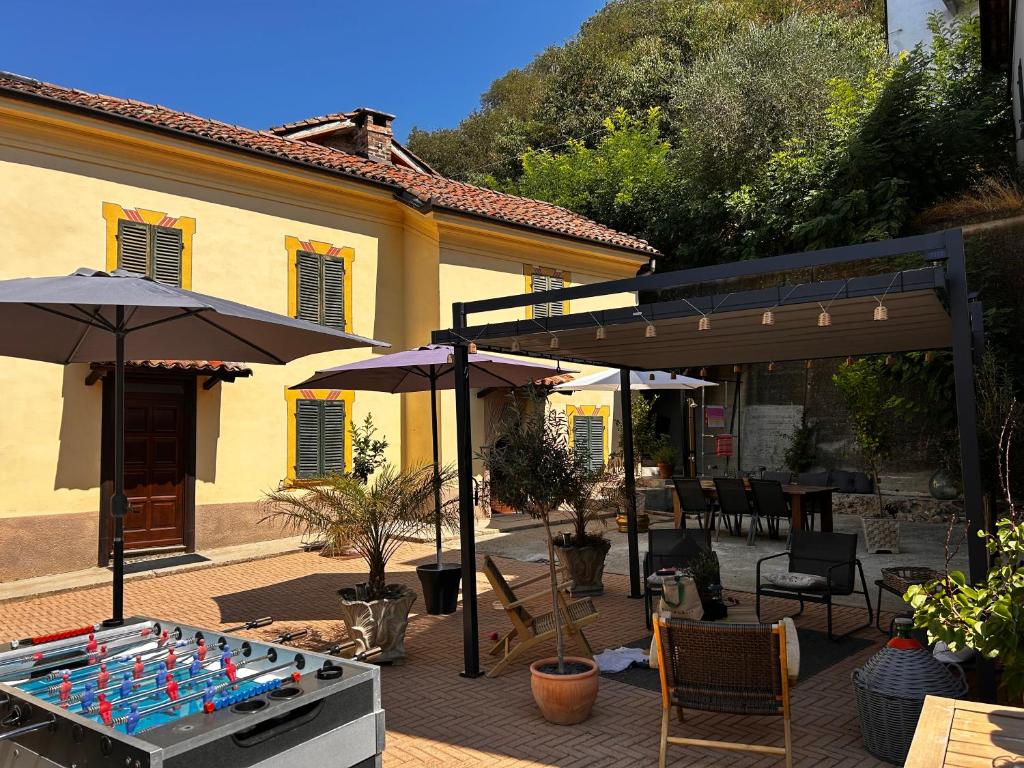 a table with a game on it in front of a house at Casa Didavani 2-6 people in Belveglio