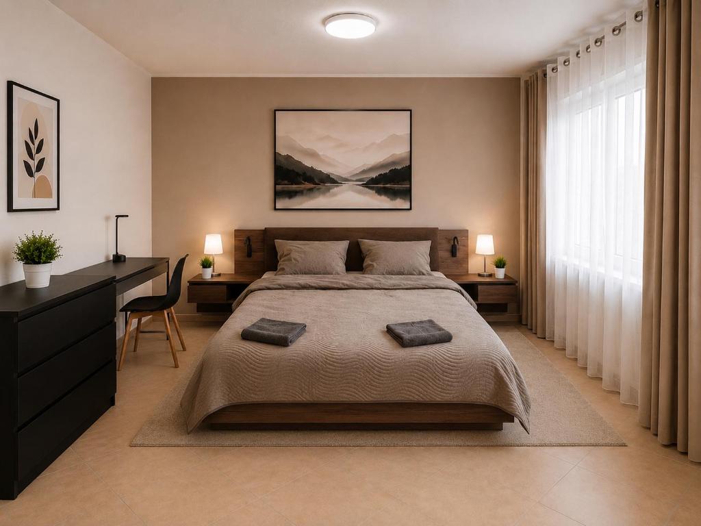 a bedroom with a large bed and a desk at Wohnliches Apartment in Koblenz-Bubenheim in Koblenz