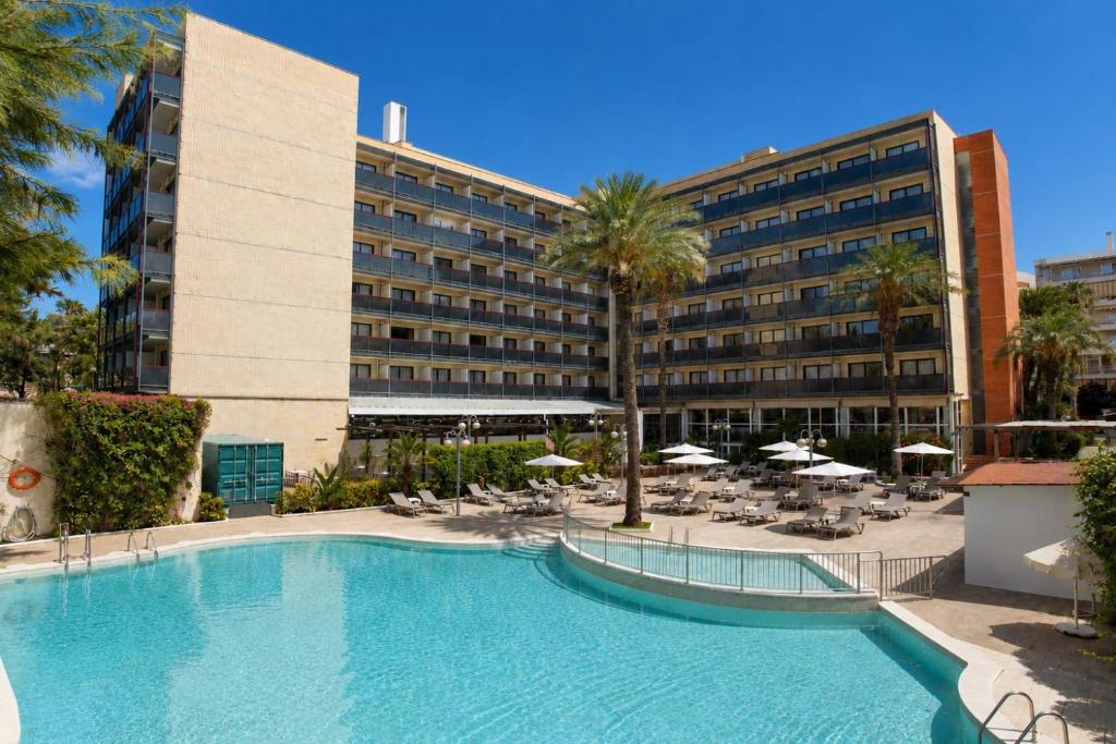 a large swimming pool in front of a hotel at Eurosalou & Spa in Salou