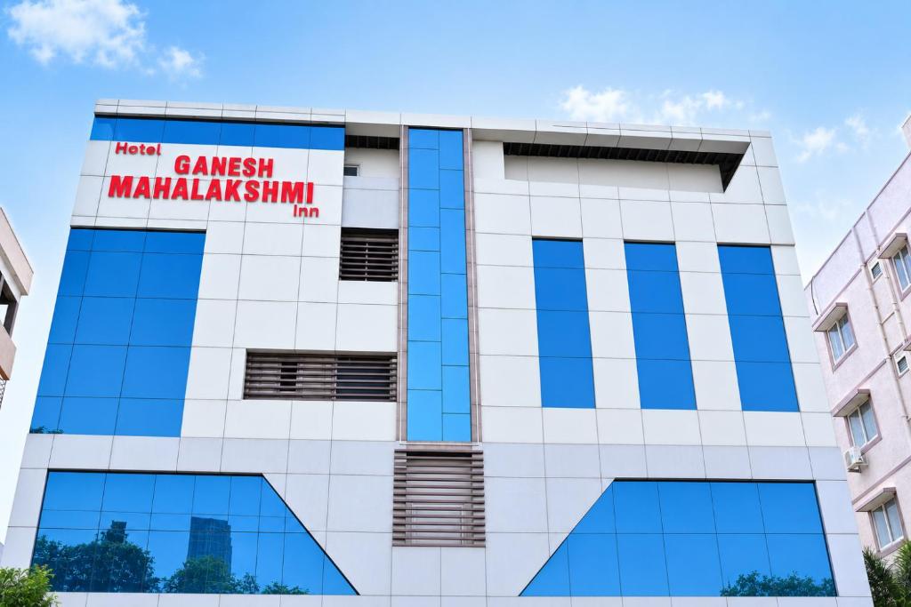 a building with a sign on it at Hotel Ganesh Mahalakshmi Inn in Guntūr