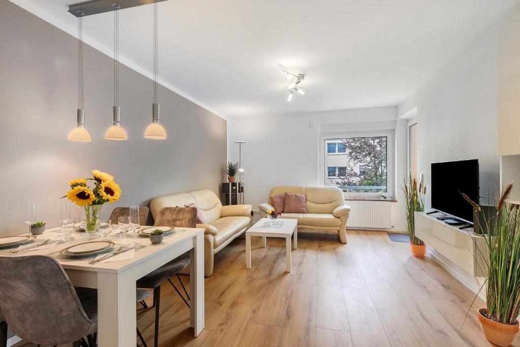 a living room with a couch and a table at Apartment Melody in Oberkochen