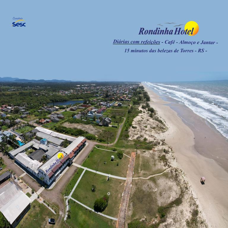 an aerial view of the shoreline of a beach at Rondinha Hotel in Arroio do Sal
