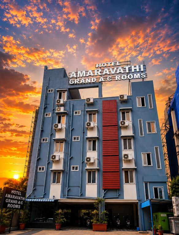 a building with a sign on top of it at Hotel Amaravathi Grand in Vijayawāda
