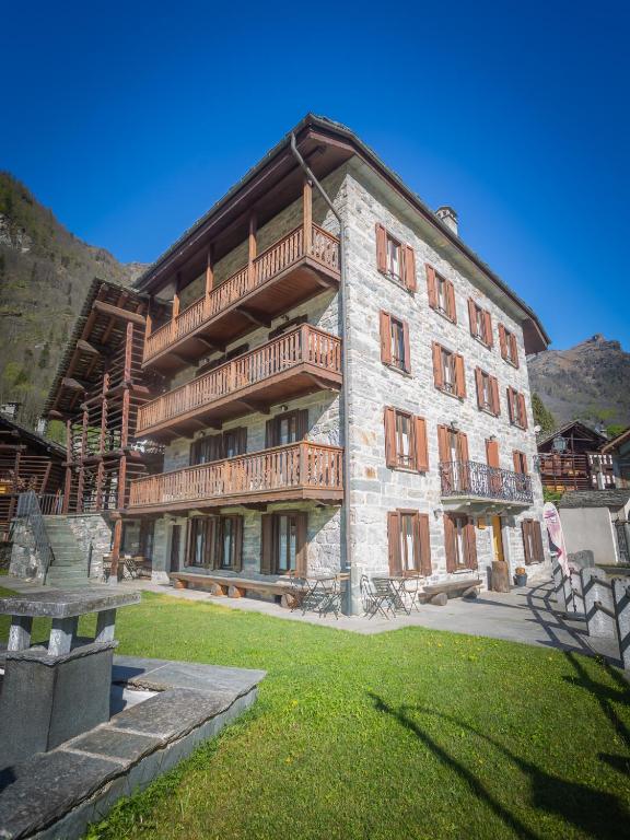 a large building with balconies on the side of it at Indren Hus in Alagna Valsesia