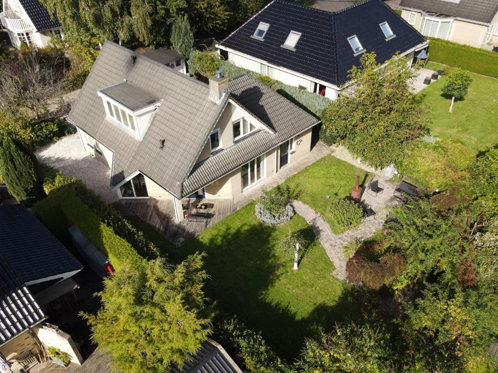an overhead view of a house with a yard at The Poplar Place - Spacious Comfort, Hot Tub in Private Garden in Zeewolde