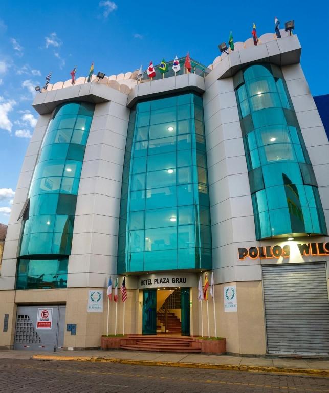 a police building with people on top of it at Hotel Plaza Grau in Trujillo