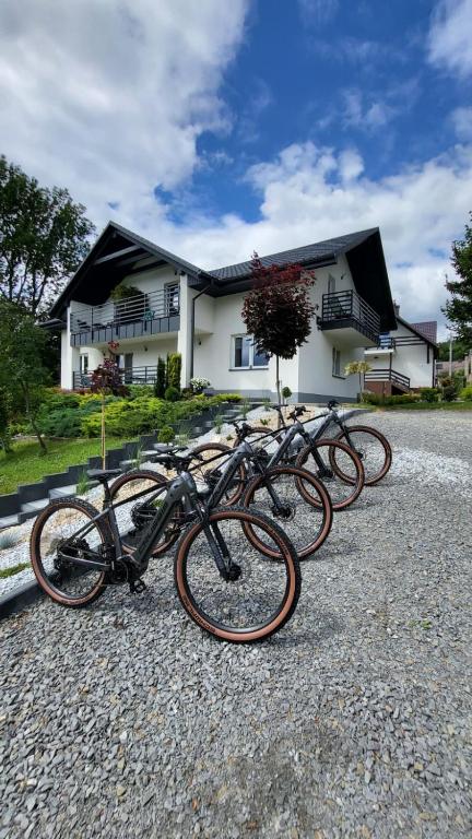 a group of bikes parked in front of a house at Noclegi Na Gołębiówce in Wadowice