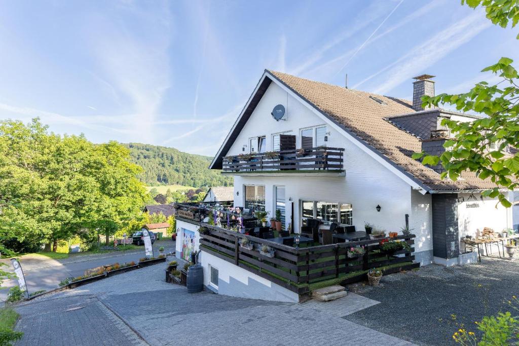 a white building with a black roof at Gretel von Birne in Winterberg