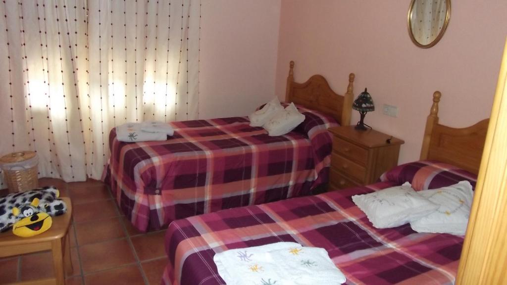 Postel nebo postele na pokoji v ubytování Casa Rural Mi Campo