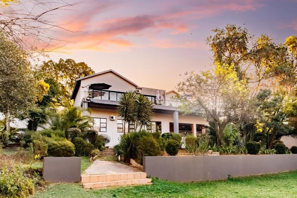 a house with a fence in front of it at Braham Lodge - The Octave in Johannesburg