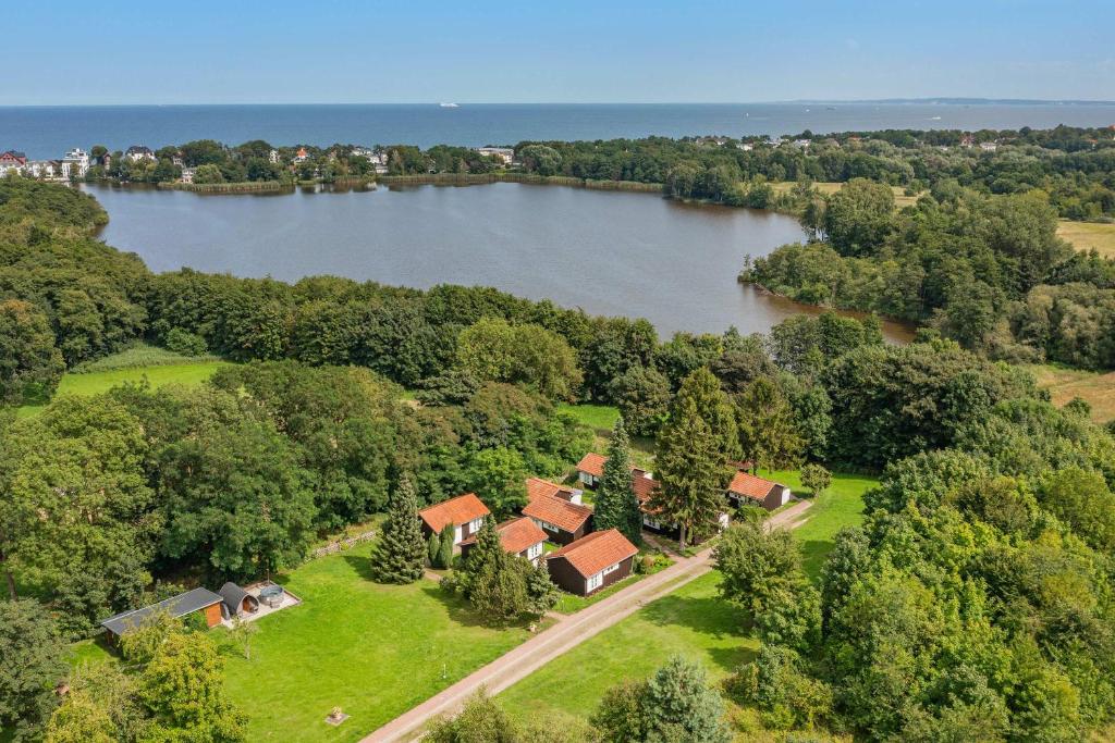 an aerial view of a house next to a lake at Ferienanlage Bansin Seepferdchen 3 in Bansin