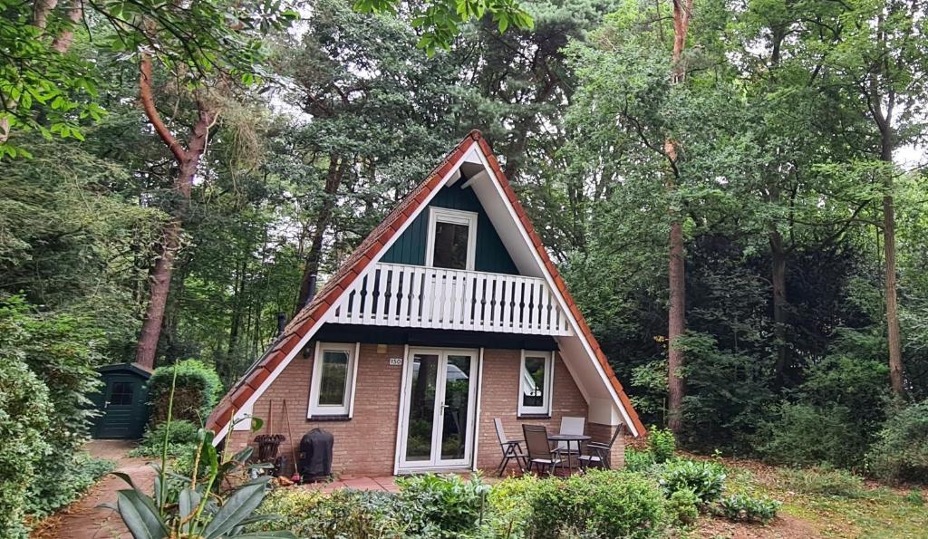a small house in the middle of a forest at Bosvilla in Harfsen