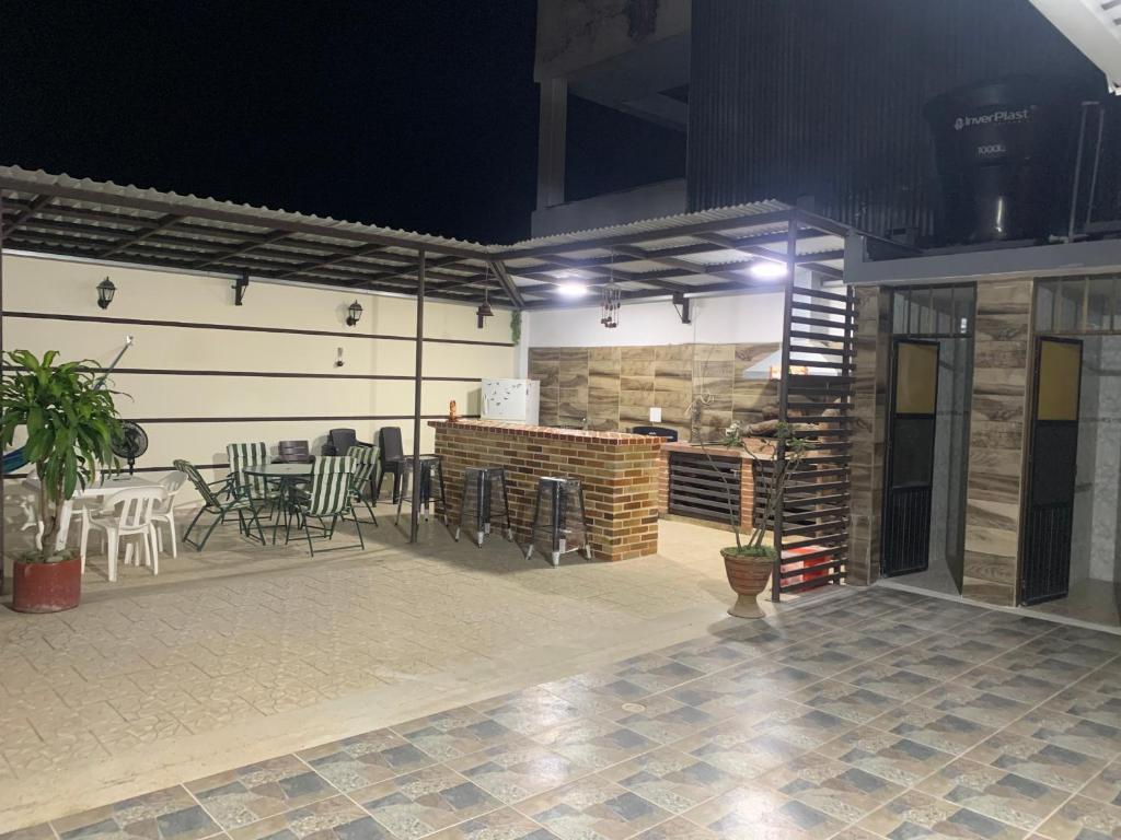 a room with a patio with a table and chairs at Acacias home in Acacías