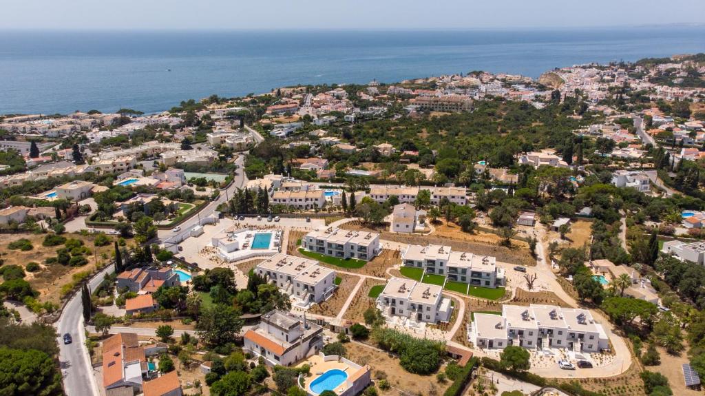an aerial view of a large estate with the ocean at Primelife Carvoeiro in Praia do Carvoeiro