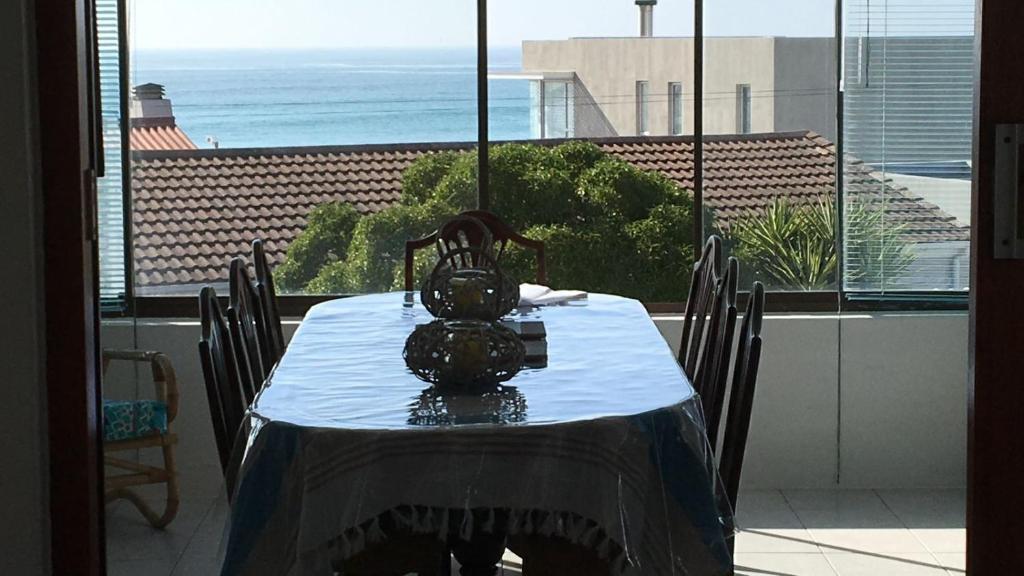 a table with a tea kettle sitting on top of it at Sundowner in Yzerfontein