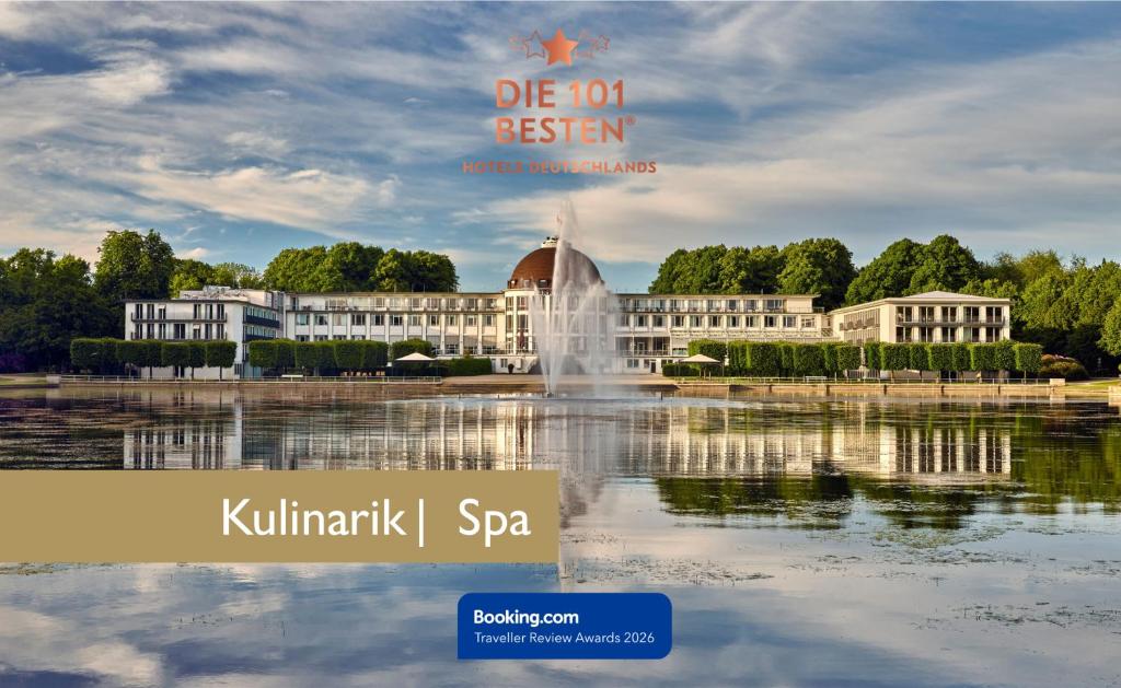 a building with a fountain in the middle of a pond at Parkhotel Bremen – ein Mitglied der Hommage Luxury Hotels Collection in Bremen