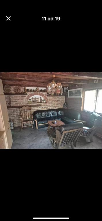 a living room with a couch and a table at Chill & Woods in Štrucljevo