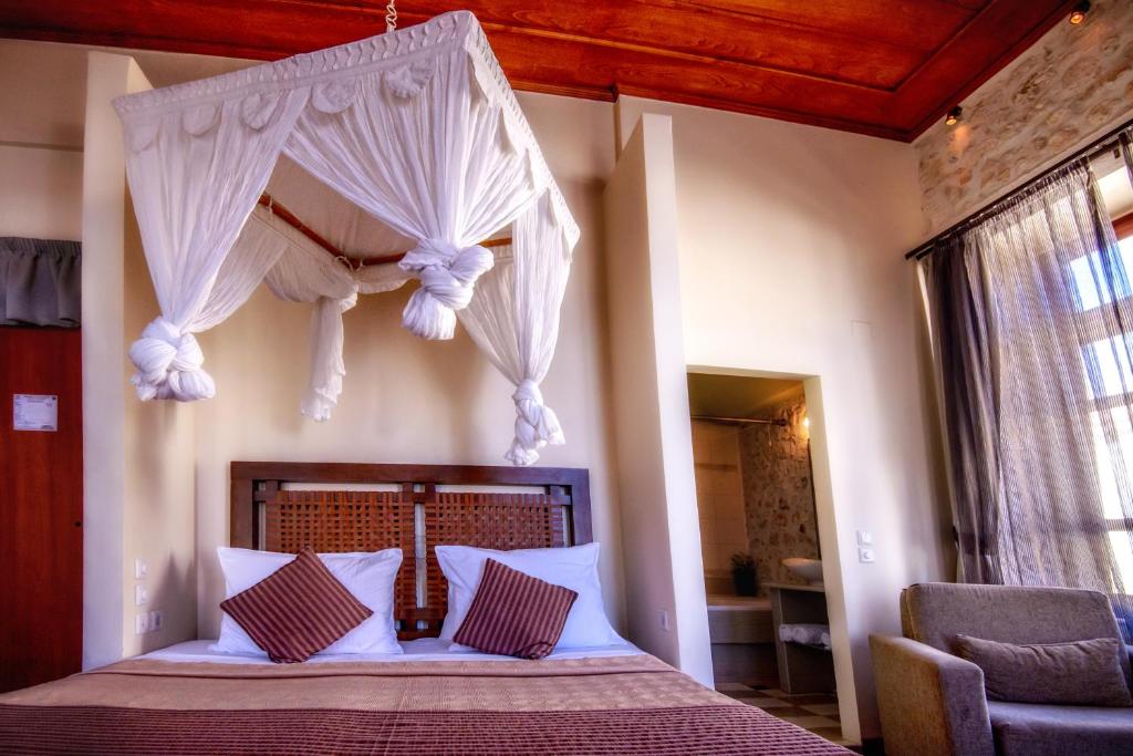Postel nebo postele na pokoji v ubytování Leo Hotel