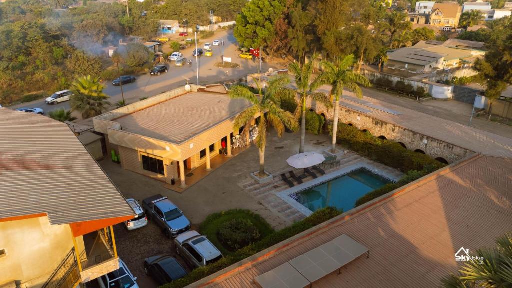 an overhead view of a building with a pool at Skyblue GuestHouse in Lubumbashi