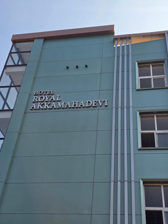 a sign on the side of a building at Hotel Royal Akkamahadevi in Sundi Penta