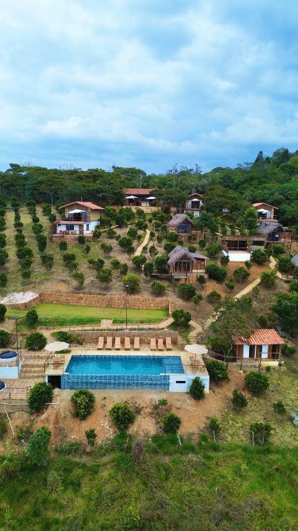 an aerial view of a house with a swimming pool at Hotel Cariguá in Barichara
