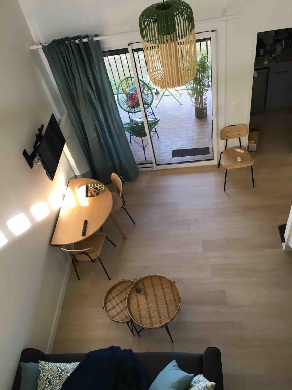 a living room with a couch and a table at Barbotinecures vacations in Barbotan-les-Thermes
