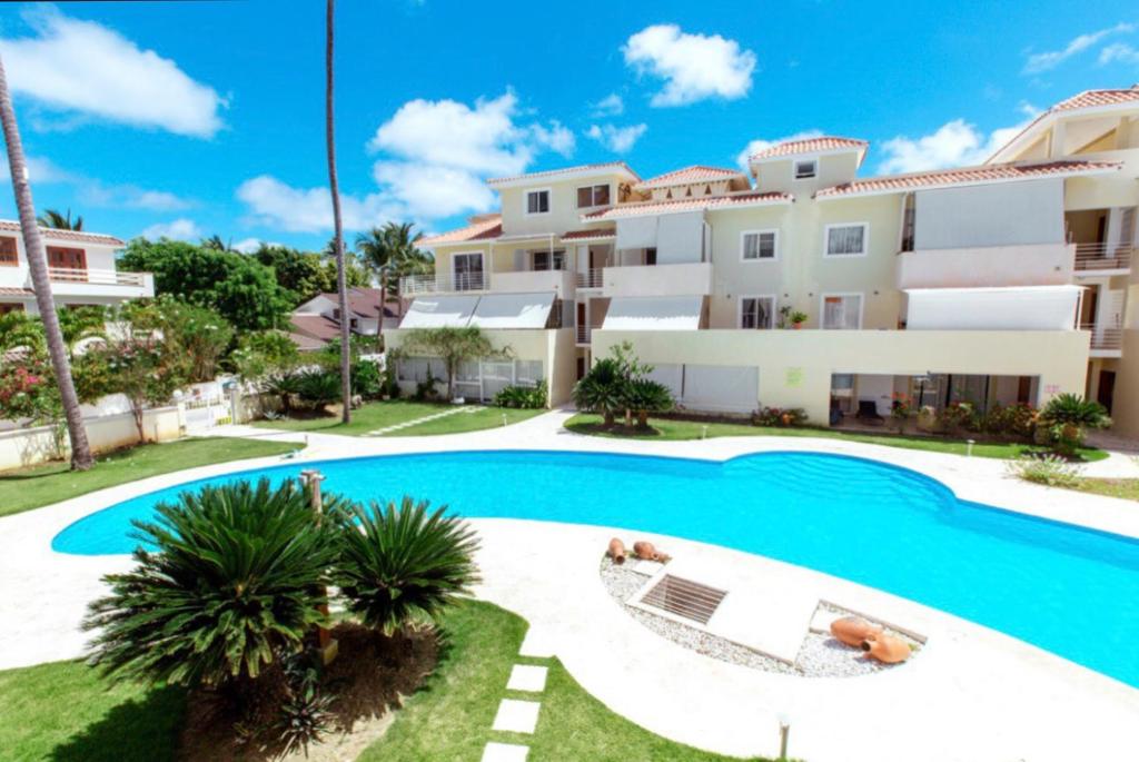 an image of a villa with a swimming pool at Los Corales CASAS DE LAS TERRAZAS Bavaro POOL VIEW HOTEL Bavaro Beach CLUB & SPA in Punta Cana