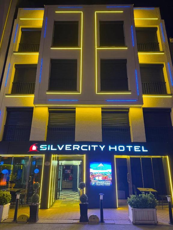 a building with a sign on the front of it at Silvercity Hotel&Suits in Eskisehir