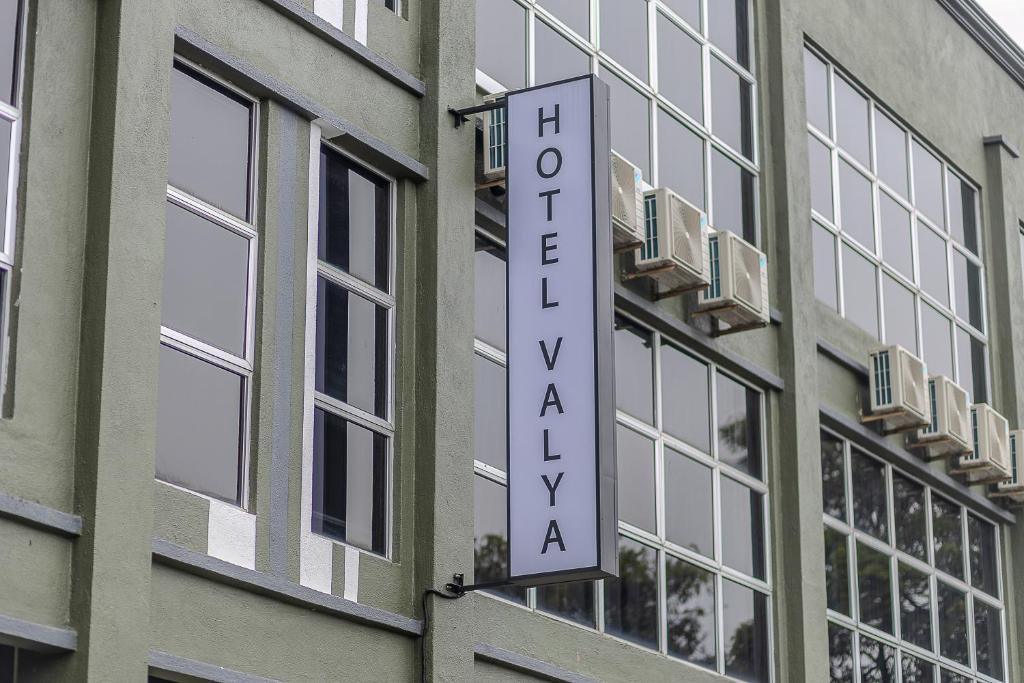 a hotel sign on the side of a building at Hotel Valya Melaka Sentral Riverfront in Malacca