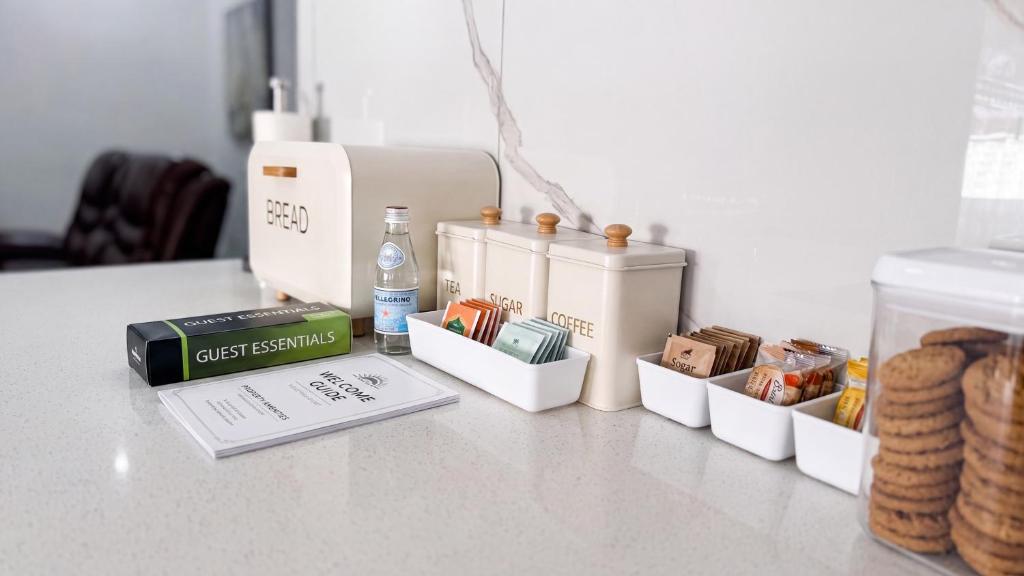 a table topped with four white containers on top of a counter at Saob Property in Germiston