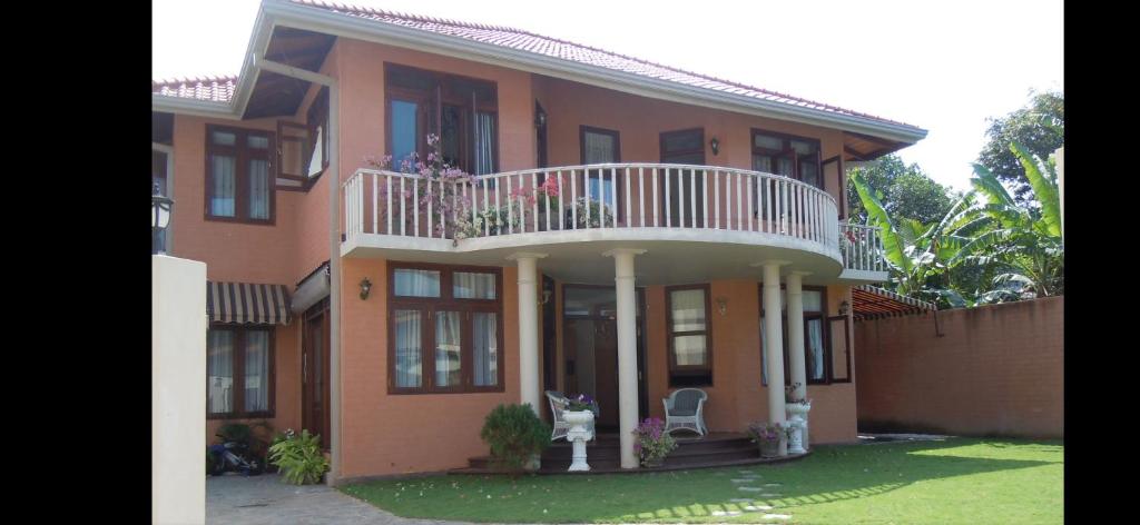 a large house with a balcony on top of it at Moratuwa suburban oasis in Moratuwa