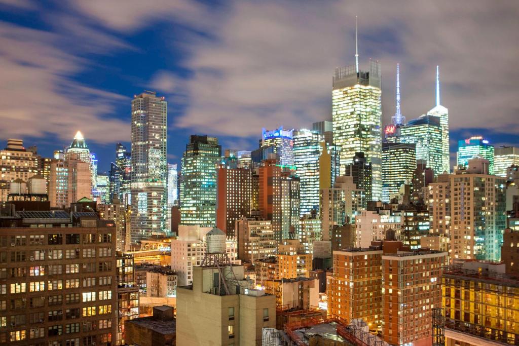 a view of a city skyline at night at Four Points by Sheraton Manhattan Midtown West in New York