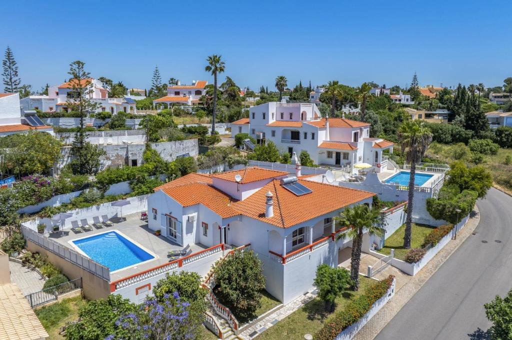 an aerial view of a house with a swimming pool at Villa Ricardo by Villa Plus in Carvoeiro