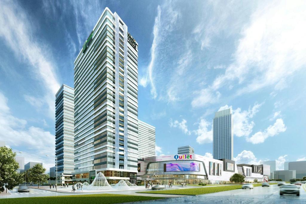 a rendering of a tall building in a city at Four Points by Sheraton Rizhao Central Activities Zone in Rizhao