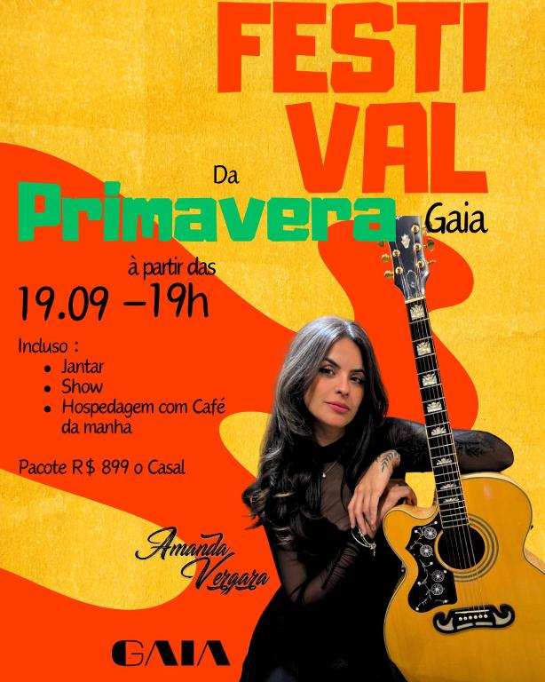 a flyer for a music festival with a woman playing a guitar at Gaia Hospedagem in Brotas