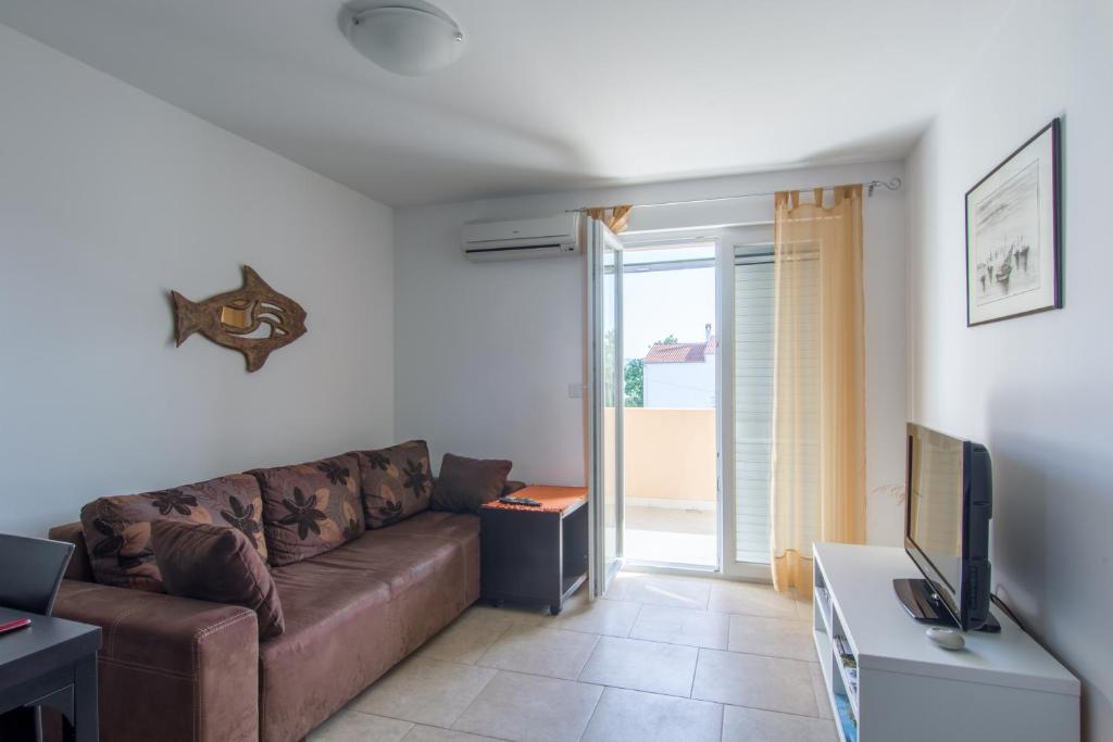 Telewizja i/lub zestaw kina domowego w obiekcie Apartments Domuzin