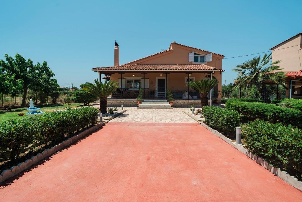 a house with a red brick driveway at Agapi's House in Kanali