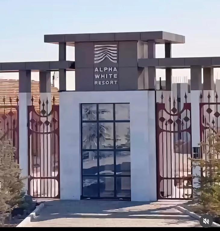 a rendering of the entrance to a white resort building at Alpha White Resort in Koshkolʼ