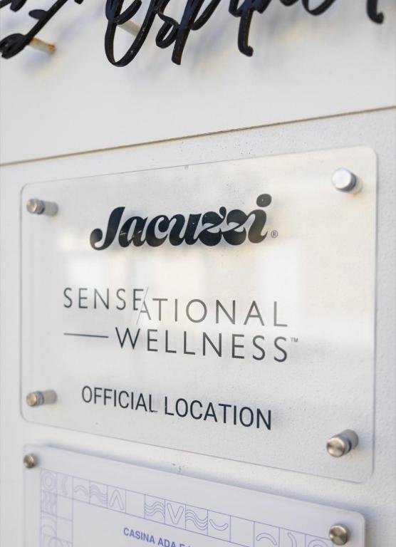 a sign for jacobsen seasonal vacation wellnessofficial location at Ada&niní in Galatina