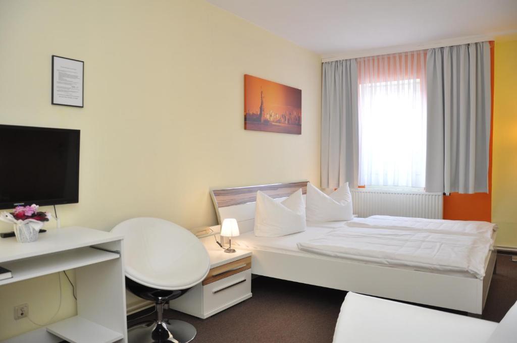 Postel nebo postele na pokoji v ubytování Hotel An der Kapelle