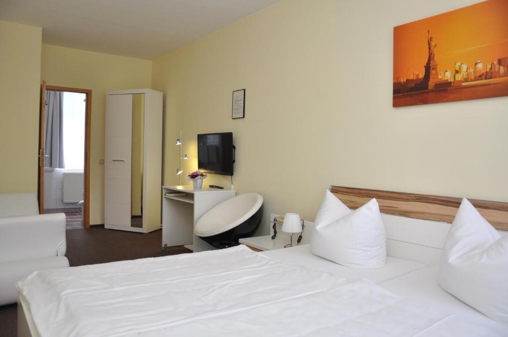 Postel nebo postele na pokoji v ubytování Hotel An der Kapelle