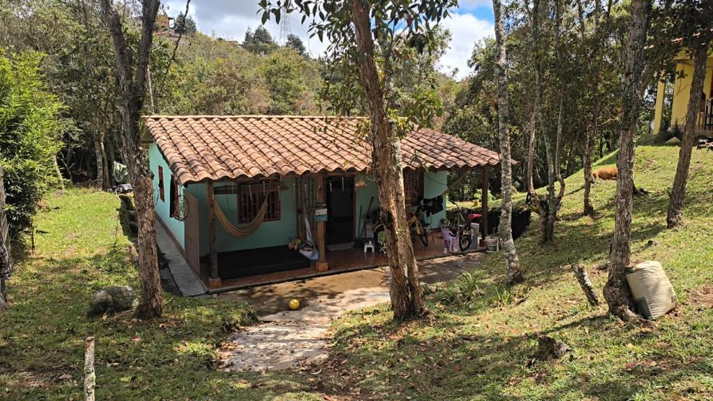 a small house in the middle of a forest at Sendero Ancestral in Guarne