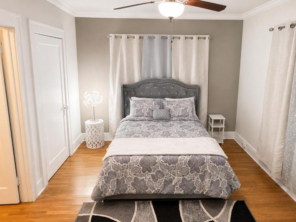 a bedroom with a bed and a ceiling fan at Convention District Studio - Downtown Houston in Houston