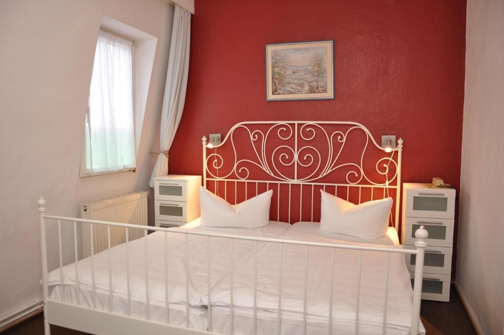 Postel nebo postele na pokoji v ubytování Hotel An der Kapelle