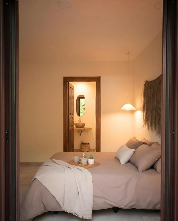 a bedroom with a bed with a tray on it at Casa Centro in Hervás